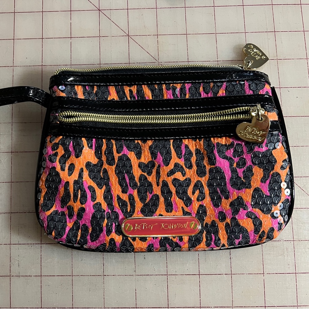 Betsey Johnson animal print sequin wristlet in black pink and orange